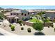 Spacious backyard featuring a well-manicured lawn, complemented by a refreshing pool and patio area at 6712 W Miner Trl, Peoria, AZ 85383