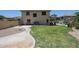 Spacious backyard with lush lawn, a walkway, a patio, and mature landscaping, great for outdoor living at 6712 W Miner Trl, Peoria, AZ 85383