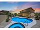 Inviting backyard with a sparkling pool, a covered patio, and ample space for outdoor gatherings at 6712 W Miner Trl, Peoria, AZ 85383