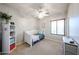 Cozy bedroom featuring a unique chandelier, a daybed, and soft carpet at 6712 W Miner Trl, Peoria, AZ 85383