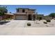 Well-maintained two-story home featuring an attached garage and a neatly landscaped front yard at 6712 W Miner Trl, Peoria, AZ 85383
