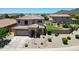 Charming two-story home showcasing landscaped front yard and well-manicured lawn with a pool at 6712 W Miner Trl, Peoria, AZ 85383