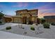 Inviting two-story home with a well-kept front yard, complemented by a spacious driveway at 6712 W Miner Trl, Peoria, AZ 85383