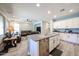 Bright open-concept kitchen features a large island, stainless appliances, and seamless flow into the living area at 6712 W Miner Trl, Peoria, AZ 85383