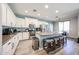 Spacious kitchen featuring an oversized island with seating and updated stainless steel appliances at 6712 W Miner Trl, Peoria, AZ 85383