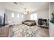 Spacious living room provides a cozy spot for relaxation with a TV and ceiling fan at 6712 W Miner Trl, Peoria, AZ 85383