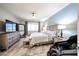 Serene main bedroom boasts a plush bed, dresser, and soothing color palette at 6712 W Miner Trl, Peoria, AZ 85383