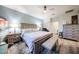 A comfy main bedroom showcases a large bed, furniture, and neutral decor at 6712 W Miner Trl, Peoria, AZ 85383