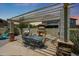 Inviting outdoor kitchen with built-in grill and covered dining area at 6712 W Miner Trl, Peoria, AZ 85383