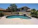Sparkling backyard pool featuring rock waterfall, spa and lush landscaping at 6712 W Miner Trl, Peoria, AZ 85383