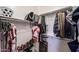 Organized walk-in closet with shelving, hanging rods, and ample storage space at 6712 W Miner Trl, Peoria, AZ 85383