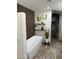 Bathroom featuring a modern freestanding tub, stylish decor, and an adjacent shower area at 6719 S Hardy Dr, Tempe, AZ 85283