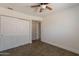 Bedroom features closet and ceiling fan at 6719 S Hardy Dr, Tempe, AZ 85283