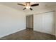Bedroom with closet, ceiling fan, and access to other rooms at 6719 S Hardy Dr, Tempe, AZ 85283