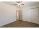 Bedroom with tile flooring, closet, and ceiling fan at 6719 S Hardy Dr, Tempe, AZ 85283
