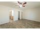 Spacious bedroom with tile floors, ceiling fan, and neutral color palette, creating a serene retreat at 6719 S Hardy Dr, Tempe, AZ 85283
