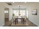 Open dining room with large windows for natural light and seating for six guests at 6719 S Hardy Dr, Tempe, AZ 85283