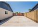 Long driveway leading to a wooden gate and two homes, showing ample parking space at 6719 S Hardy Dr, Tempe, AZ 85283