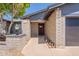 Inviting entrance with brick accents, manicured landscaping, and covered entry, highlighting the home's curb appeal at 6719 S Hardy Dr, Tempe, AZ 85283