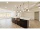 The kitchen island features pendant lighting and a copper colored farmhouse sink at 6719 S Hardy Dr, Tempe, AZ 85283
