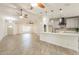 Open concept view of living room & island kitchen with breakfast bar and stainless appliances at 6719 S Hardy Dr, Tempe, AZ 85283