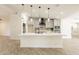Bright kitchen features an island with seating, pendant lighting, and stainless appliances at 6719 S Hardy Dr, Tempe, AZ 85283