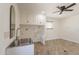 Up-close view of the laundry area featuring stainless steel sink and overhead storage in an inviting space at 6719 S Hardy Dr, Tempe, AZ 85283