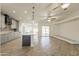 Spacious open concept featuring wood-look tile flooring and access to the kitchen at 6719 S Hardy Dr, Tempe, AZ 85283