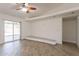 Bright living room featuring sliding doors, custom bench, and wood-look floors at 6719 S Hardy Dr, Tempe, AZ 85283