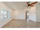 Bright and airy living room featuring tile floors, ceiling fan, and ample natural light at 6719 S Hardy Dr, Tempe, AZ 85283
