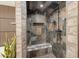 Walk in shower featuring stylish tile design, a convenient bench, and modern shower fixtures at 6719 S Hardy Dr, Tempe, AZ 85283