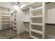 Spacious walk-in closet with mirror and ample shelving at 6719 S Hardy Dr, Tempe, AZ 85283