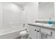 Bright bathroom featuring a shower-tub combo, grey countertops and ample storage beneath the sink at 701 S Dobson Rd # 203, Mesa, AZ 85202