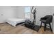 Bedroom featuring an exercise machine and a chair near a window offering natural light at 701 S Dobson Rd # 203, Mesa, AZ 85202