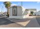 Charming manufactured home with covered parking and well maintained exterior and mature trees at 701 S Dobson Rd # 203, Mesa, AZ 85202