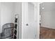 Hallway closet with ladder showcases the interior of a clean and simple storage space at 701 S Dobson Rd # 203, Mesa, AZ 85202