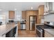 Modern kitchen featuring stainless steel appliances and a stainless steel range hood, perfect for cooking at 701 S Dobson Rd # 203, Mesa, AZ 85202