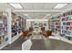 Community library featuring bookshelves lined with books, 4 chairs and tables at 701 S Dobson Rd # 203, Mesa, AZ 85202