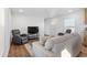 Comfortable living room featuring a cozy couch, recliners, and television set, perfect for relaxing at 701 S Dobson Rd # 203, Mesa, AZ 85202