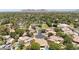 An impressive aerial captures the community's tree-lined streets and manicured lawns in a neighborhood near mountain views at 7032 N 2Nd Ave, Phoenix, AZ 85021