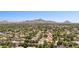 Enjoy scenic community views from above, complete with tree-lined streets and homes, set against a mountain backdrop at 7032 N 2Nd Ave, Phoenix, AZ 85021
