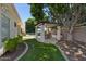 Beautiful backyard with a covered patio, lush lawn, and sparkling pool at 7032 N 2Nd Ave, Phoenix, AZ 85021