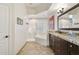 Bathroom featuring tile floors, a tub with tile surround, and granite counters at 7032 N 2Nd Ave, Phoenix, AZ 85021