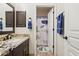 Neutral bathroom featuring granite counters, vanity, and shower with an animal themed shower curtain at 7032 N 2Nd Ave, Phoenix, AZ 85021