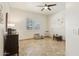 Well-lit bedroom featuring tile flooring, a large window, and an open floor plan with modern fixtures at 7032 N 2Nd Ave, Phoenix, AZ 85021
