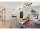 Spacious living room featuring hardwood floors, arched entry, and decorative furnishings at 7032 N 2Nd Ave, Phoenix, AZ 85021