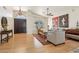 Bright and airy living room with a ceiling fan, hardwood floors, and a front door view at 7032 N 2Nd Ave, Phoenix, AZ 85021