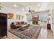 Bright living room features a stone fireplace, plush leather couch, and stylish decor at 7032 N 2Nd Ave, Phoenix, AZ 85021