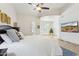 Inviting main bedroom with a ceiling fan, tiled floors, and a view of the bay window at 7032 N 2Nd Ave, Phoenix, AZ 85021