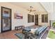 Relaxing covered patio with outdoor seating, ceiling fan, and mounted television at 7032 N 2Nd Ave, Phoenix, AZ 85021